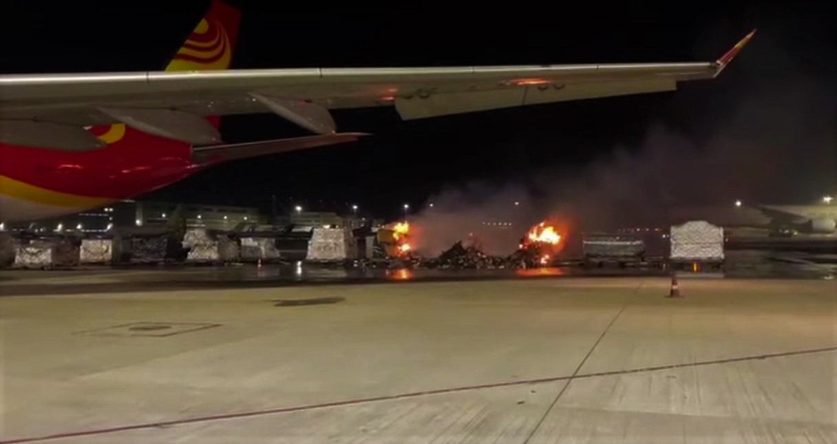 Flash News  -  Video  footage  of   Cargo  pallets  on  fire  waiting  to  be  loaded  to  a  HongKong  Air  Freighter  Airbus  A330-200F.